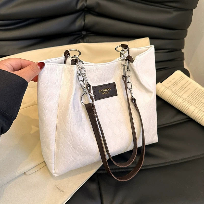 Nova bolsa tote feminina, grande capacidade, bolsa de ombro. Super fácil de combinar com looks de trabalho. Estilo coreano, design diferenciado e moderno.