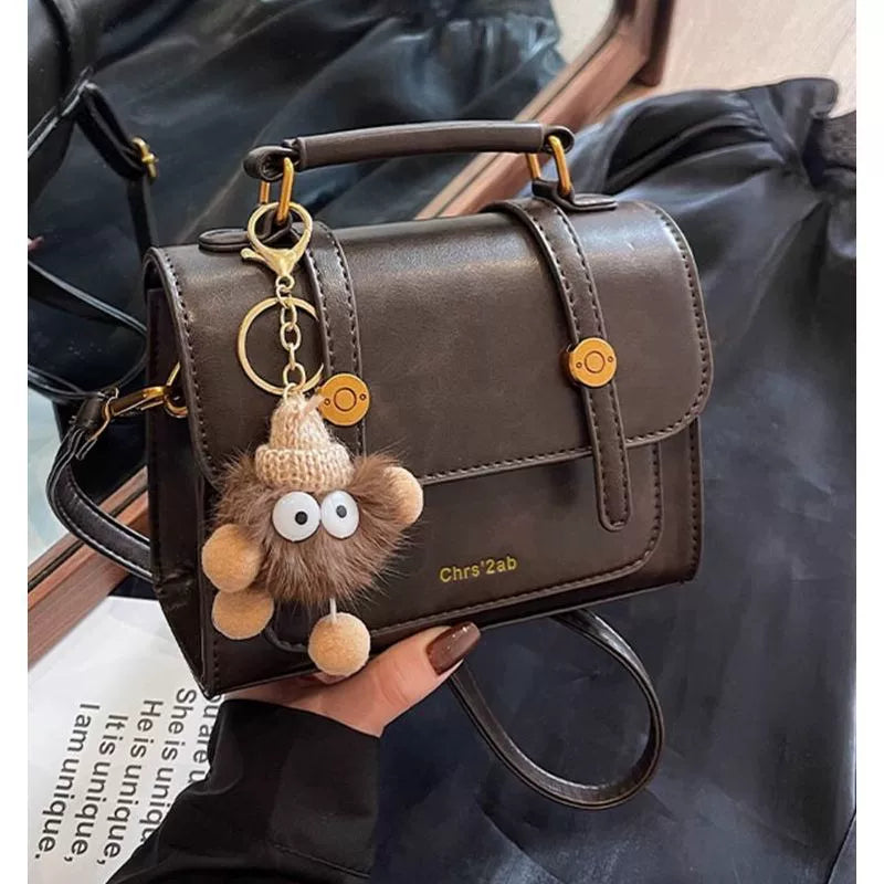 Bolsa pequena retrô de textura sofisticada, nova bolsa transversal versátil feminina, bolsa quadrada pequena de mão super moderna e popular.