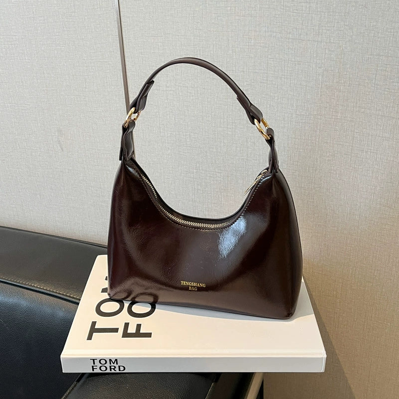 Bolsa de couro texturizado a óleo para atacado internacional, feminina, nova coleção 2026, moda, mais fácil de combinar, bolsa tiracolo, de ombro, pequena, para usar embaixo do braço.