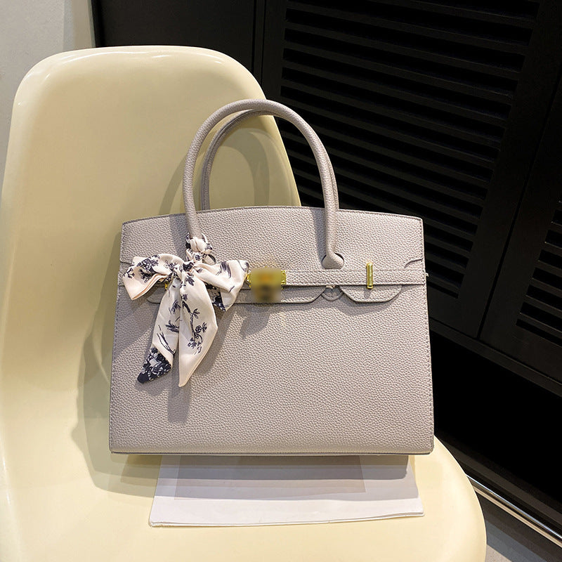 Bolsa Kelly de Grande Capacidade Feminina 2026 Nova ColeçãoEstilo de NichoLuxo AcessívelBolsa de Ombro para TrabalhoBolsa Satchel Feminina Elegante