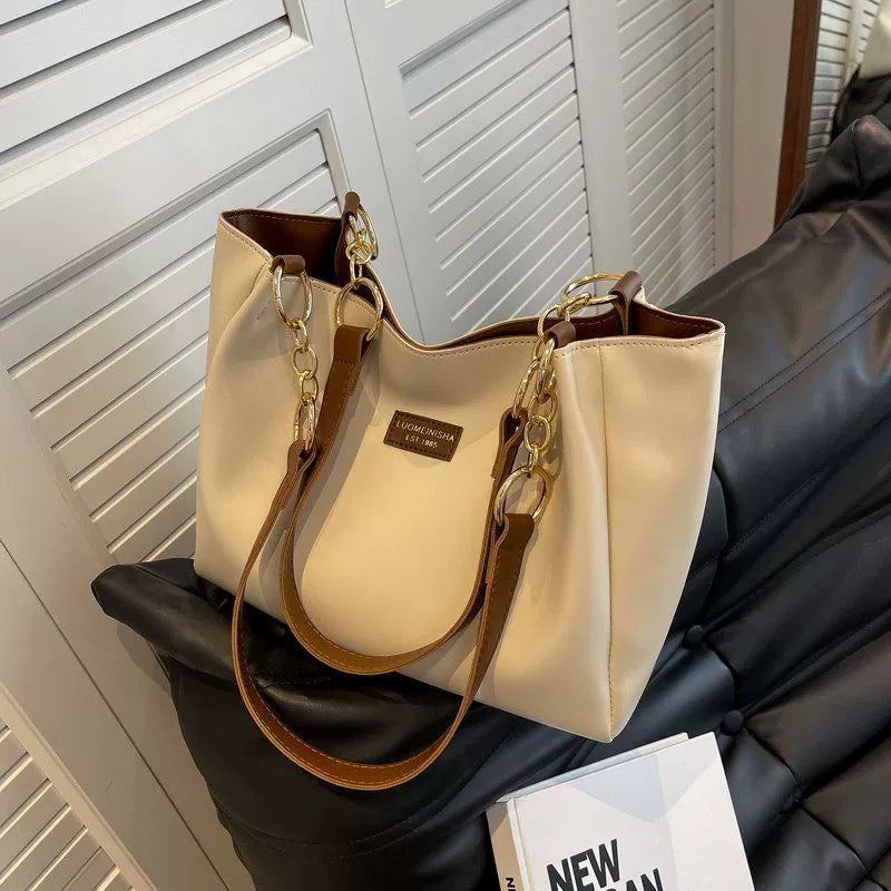 Bolsas femininas de grande capacidade populares deste ano, nova moda 2025, luxo leve, alta qualidade, acessível, bolsa tote de ombro único para o dia a dia.