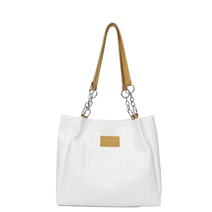 Nova bolsa tote feminina, grande capacidade, bolsa de ombro. Super fácil de combinar com looks de trabalho. Estilo coreano, design diferenciado e moderno.