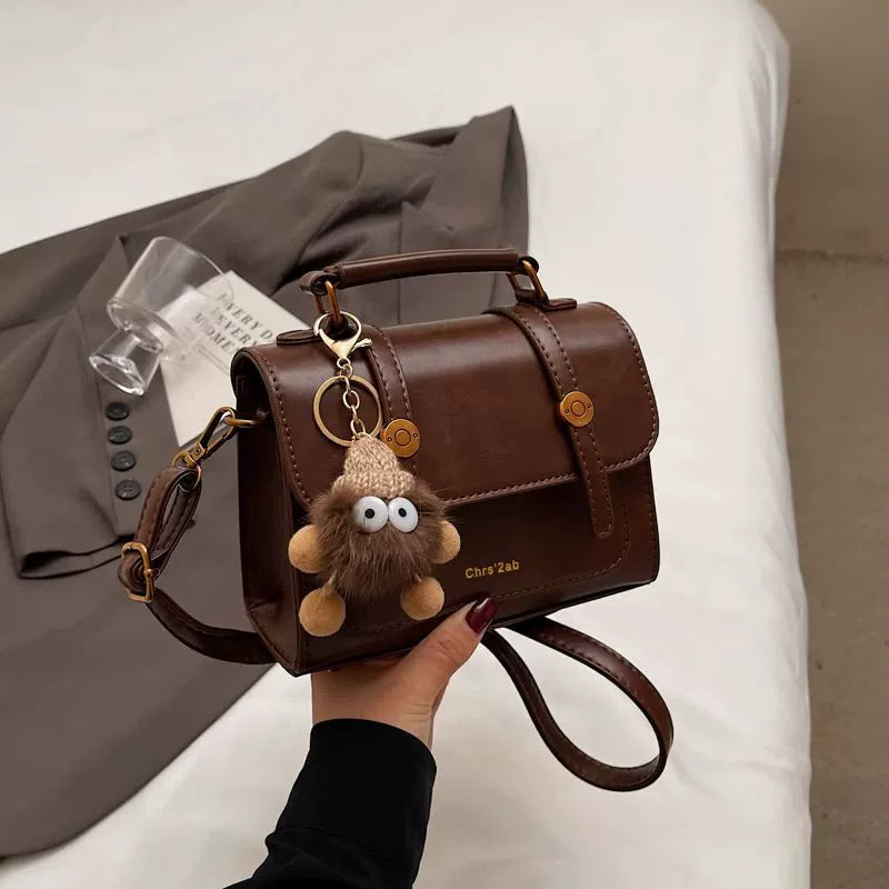 Bolsa pequena retrô de textura sofisticada, nova bolsa transversal versátil feminina, bolsa quadrada pequena de mão super moderna e popular.