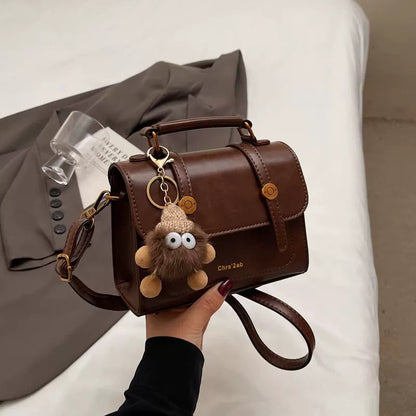Bolsa pequena retrô de textura sofisticada, nova bolsa transversal versátil feminina, bolsa quadrada pequena de mão super moderna e popular.
