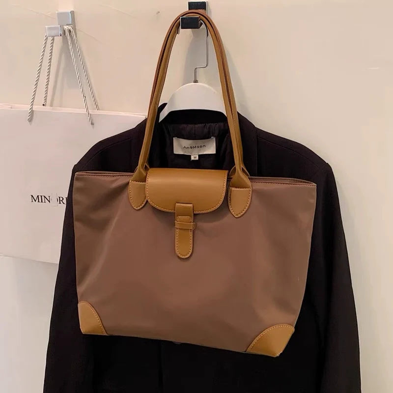 Bolsa tote prática de grande capacidade para estudantes femininas, versátil para deslocamentos, bolsa feminina de ombro único em tecido Oxford e nylon, bolsa tote transfronteiriça.