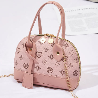 2026 Nova Moda, Luxo Leve, Niche Monica & Friends Bolsa Feminina de Alto Padrão - Bolsa Shell com Bloco de Cores Estampado