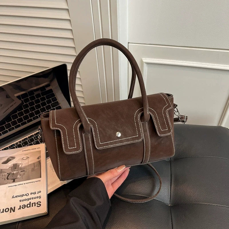 Bolsas de nicho de alto padrão para mulheres, nova coleção primavera/verão 2026, bolsa vintage versátil de ombro e transversal, bolsa feminina popular.