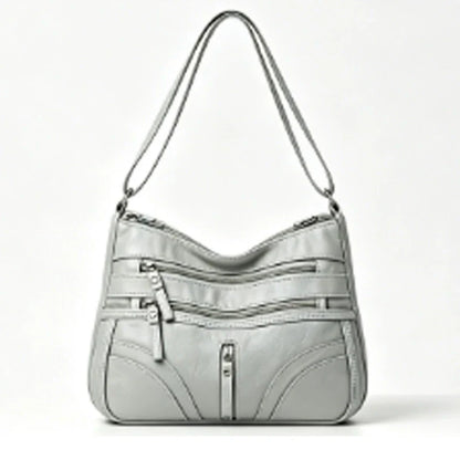 Nova coleção de bolsas de exportação transfronteiriça. A bolsa feminina mais fácil de combinar, bolsa tiracolo, bolsa de ombro de grande capacidade com textura de couro macio e moderna, bolsa de vestuário feminino.