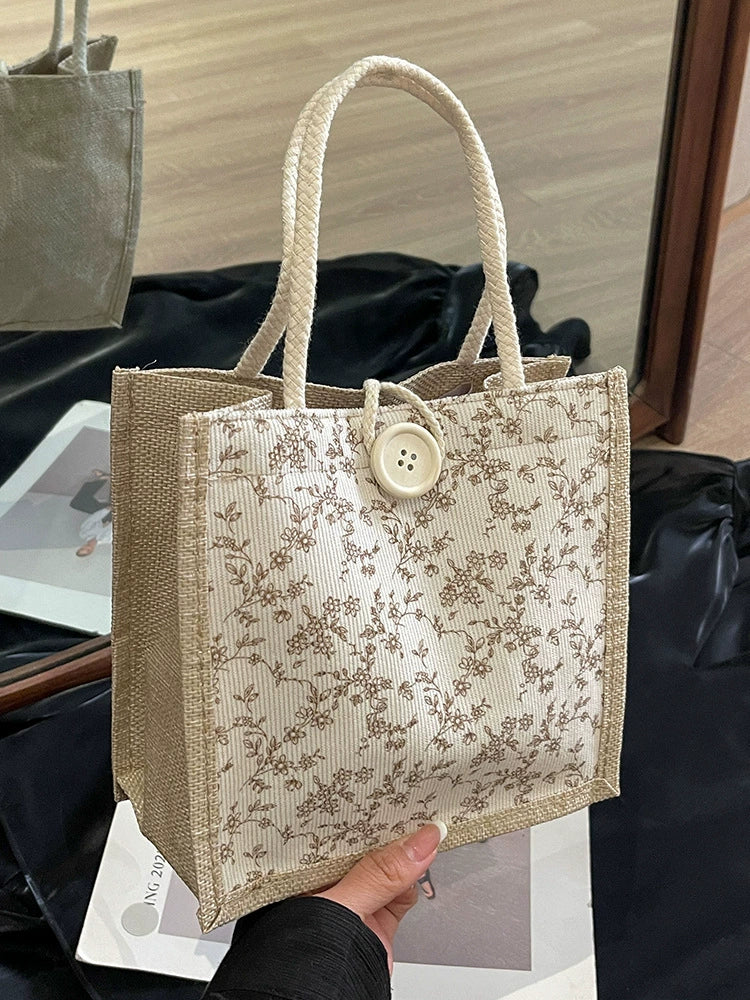 Bolsa de almoço de mão floral estilo francês de verão 2025 bolsa de mão versátil para menina japonesa ins escritório deslocamento.