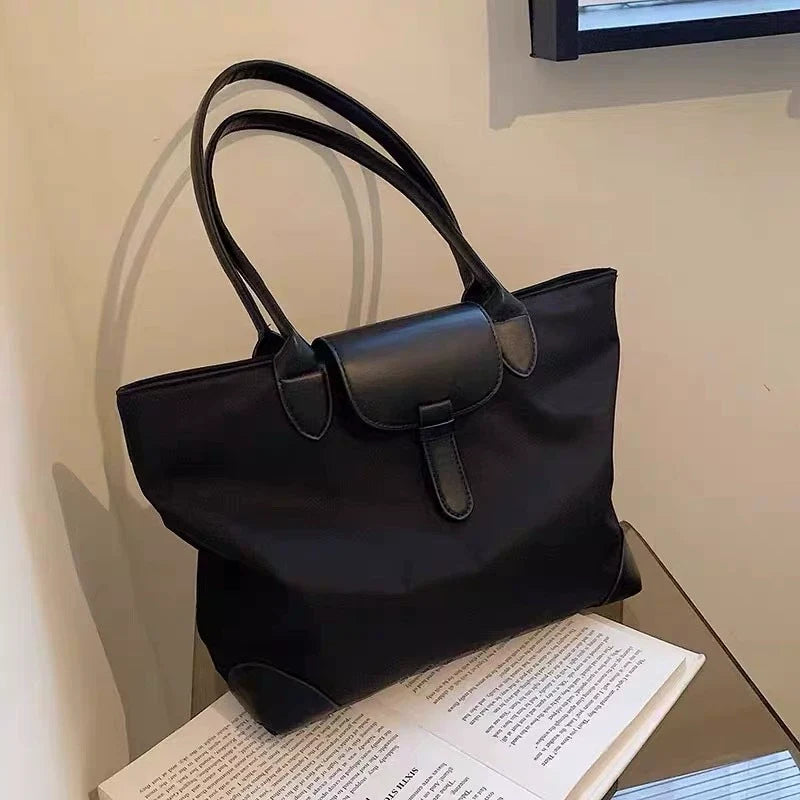 Bolsa tote prática de grande capacidade para estudantes femininas, versátil para deslocamentos, bolsa feminina de ombro único em tecido Oxford e nylon, bolsa tote transfronteiriça.
