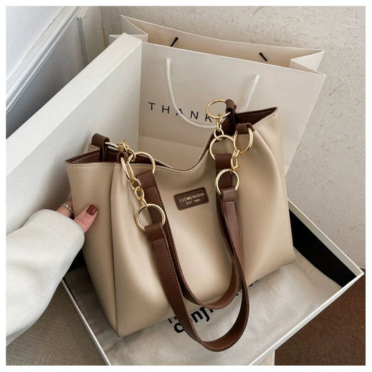 Bolsas femininas de grande capacidade populares deste ano, nova moda 2025, luxo leve, alta qualidade, acessível, bolsa tote de ombro único para o dia a dia.