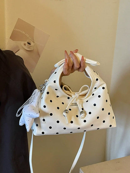 A bolsa feminina da moda deste ano com laço e bolinhas, uma novidade elegante e versátil de 2026. Uma bolsa transversal chique que também pode ser usada como bolsa de ombro ou carregada como bolsa de mão.