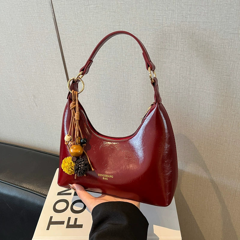 Bolsa de couro texturizado a óleo para atacado internacional, feminina, nova coleção 2026, moda, mais fácil de combinar, bolsa tiracolo, de ombro, pequena, para usar embaixo do braço.
