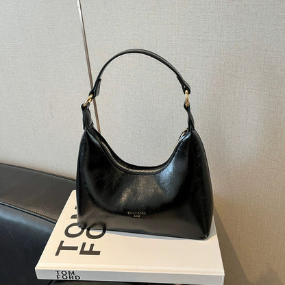 Bolsa de couro texturizado a óleo para atacado internacional, feminina, nova coleção 2026, moda, mais fácil de combinar, bolsa tiracolo, de ombro, pequena, para usar embaixo do braço.