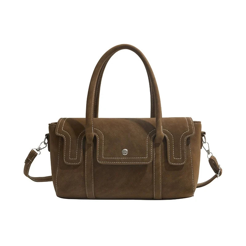 Bolsas de nicho de alto padrão para mulheres, nova coleção primavera/verão 2026, bolsa vintage versátil de ombro e transversal, bolsa feminina popular.