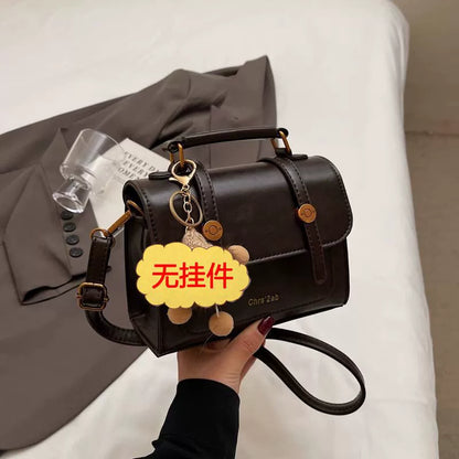 Bolsa pequena retrô de textura sofisticada, nova bolsa transversal versátil feminina, bolsa quadrada pequena de mão super moderna e popular.
