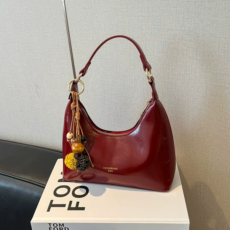 Bolsa de couro texturizado a óleo para atacado internacional, feminina, nova coleção 2026, moda, mais fácil de combinar, bolsa tiracolo, de ombro, pequena, para usar embaixo do braço.