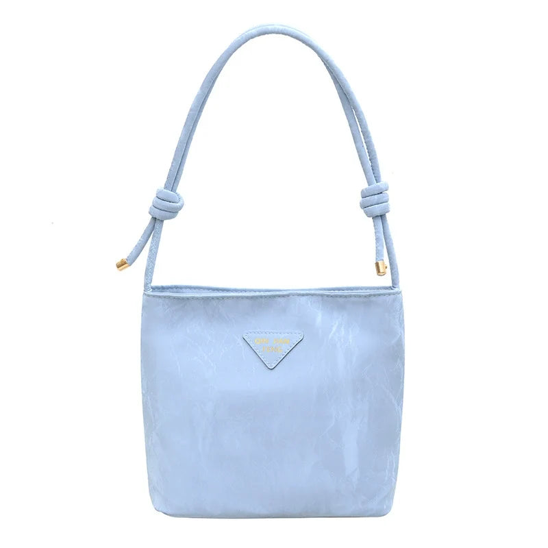 Bolsa de ombro casual feminina, versátil e charmosa. Bolsa tiracolo para o trabalho, elegante e ideal para o dia a dia. Bolsa de axila versátil para atacado.