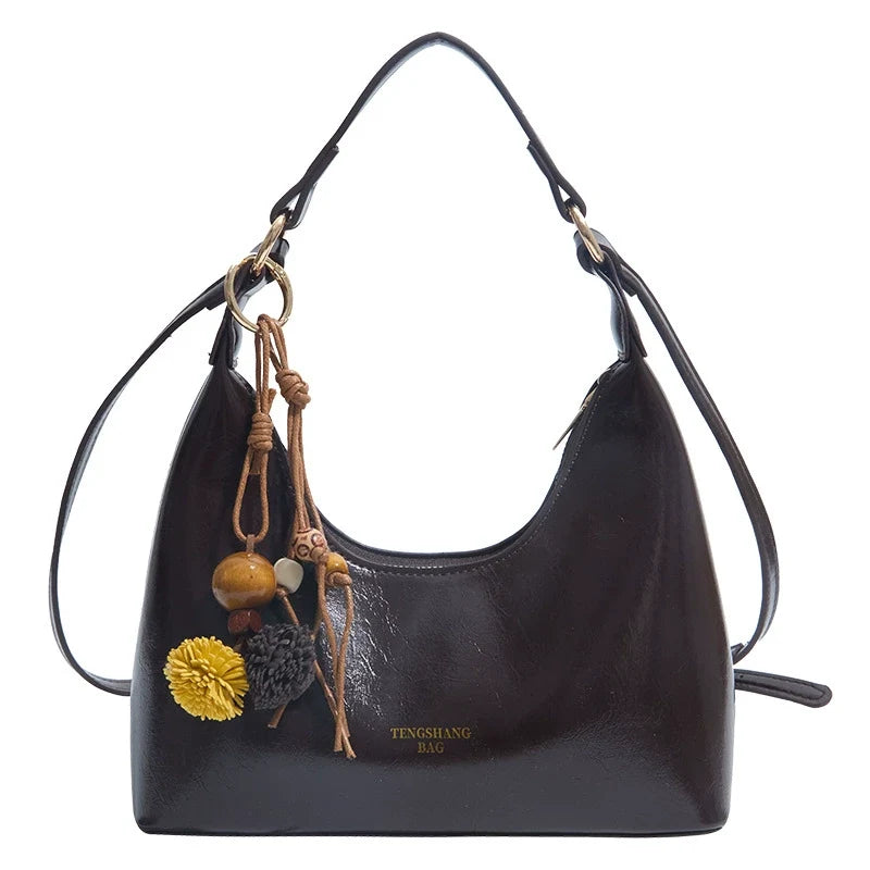 Bolsa de couro texturizado a óleo para atacado internacional, feminina, nova coleção 2026, moda, mais fácil de combinar, bolsa tiracolo, de ombro, pequena, para usar embaixo do braço.