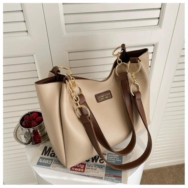 Bolsas femininas de grande capacidade populares deste ano, nova moda 2025, luxo leve, alta qualidade, acessível, bolsa tote de ombro único para o dia a dia.