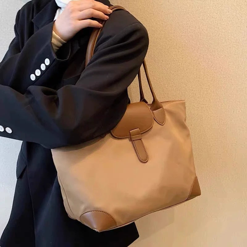 Bolsa tote prática de grande capacidade para estudantes femininas, versátil para deslocamentos, bolsa feminina de ombro único em tecido Oxford e nylon, bolsa tote transfronteiriça.