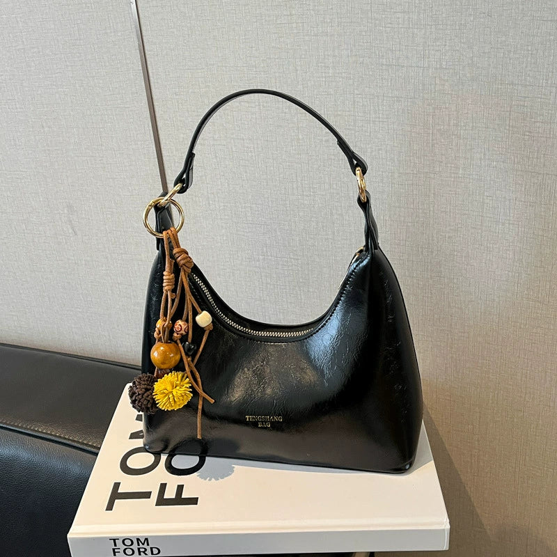 Bolsa de couro texturizado a óleo para atacado internacional, feminina, nova coleção 2026, moda, mais fácil de combinar, bolsa tiracolo, de ombro, pequena, para usar embaixo do braço.