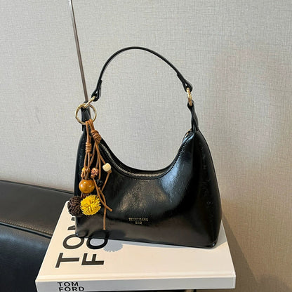 Bolsa de couro texturizado a óleo para atacado internacional, feminina, nova coleção 2026, moda, mais fácil de combinar, bolsa tiracolo, de ombro, pequena, para usar embaixo do braço.