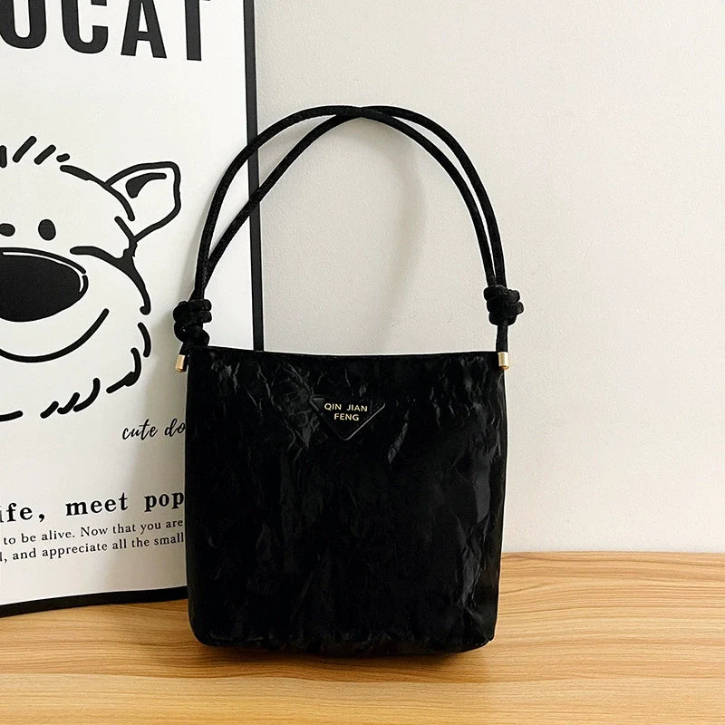 Bolsa de ombro casual feminina, versátil e charmosa. Bolsa tiracolo para o trabalho, elegante e ideal para o dia a dia. Bolsa de axila versátil para atacado.