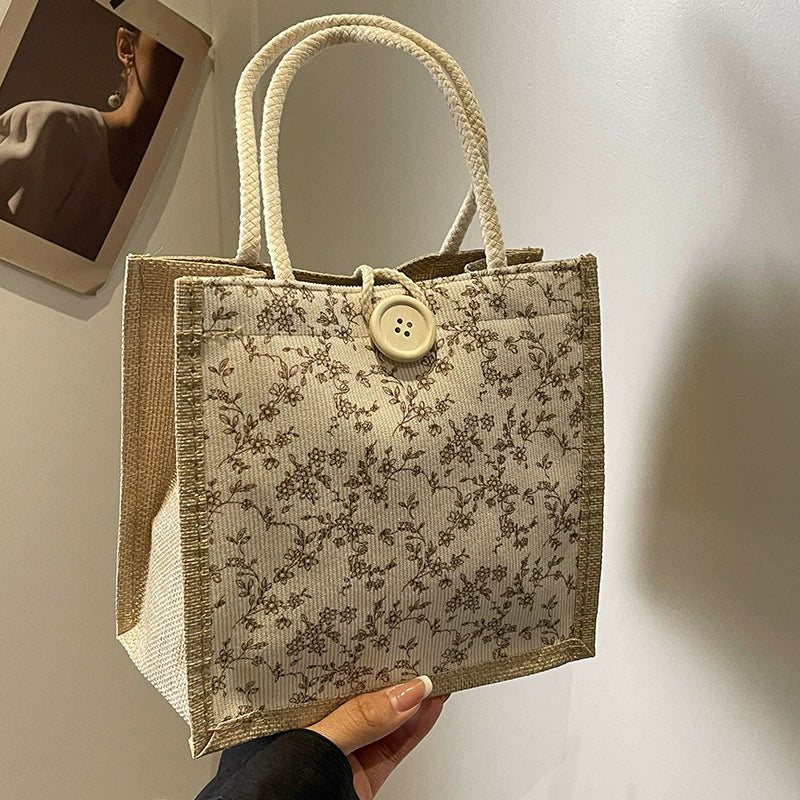 Bolsa de almoço de mão floral estilo francês de verão 2025 bolsa de mão versátil para menina japonesa ins escritório deslocamento.
