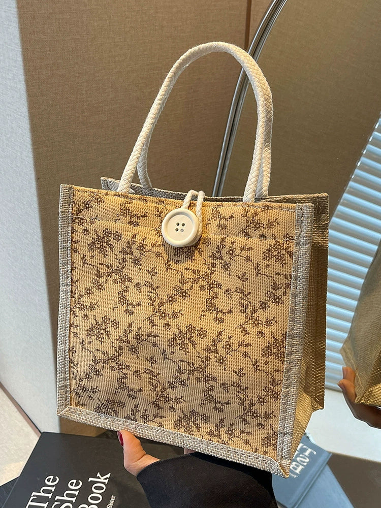 Bolsa de almoço de mão floral estilo francês de verão 2025 bolsa de mão versátil para menina japonesa ins escritório deslocamento.