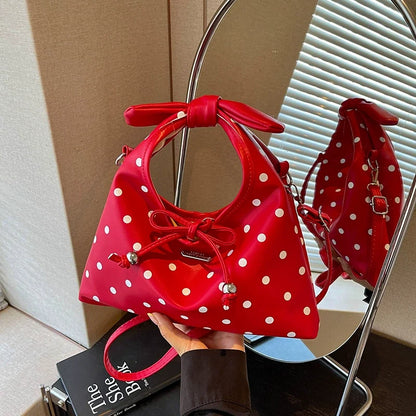 A bolsa feminina da moda deste ano com laço e bolinhas, uma novidade elegante e versátil de 2026. Uma bolsa transversal chique que também pode ser usada como bolsa de ombro ou carregada como bolsa de mão.