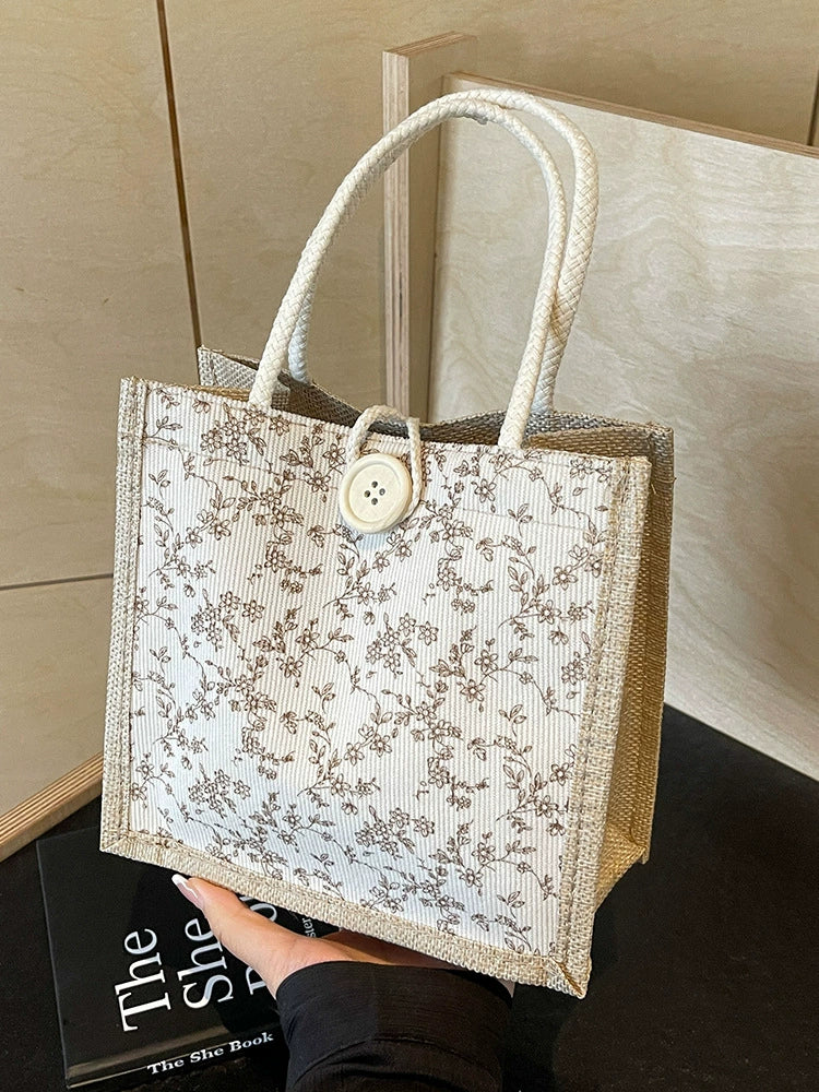 Bolsa de almoço de mão floral estilo francês de verão 2025 bolsa de mão versátil para menina japonesa ins escritório deslocamento.