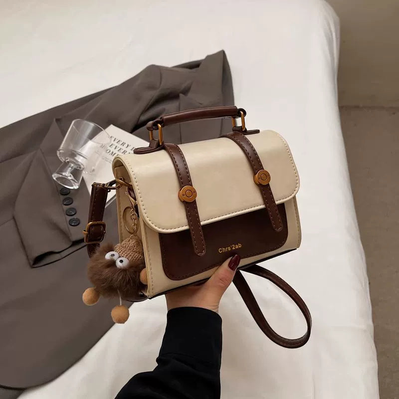 Bolsa pequena retrô de textura sofisticada, nova bolsa transversal versátil feminina, bolsa quadrada pequena de mão super moderna e popular.