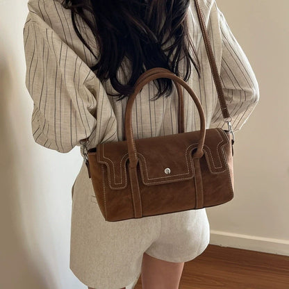 Bolsas de nicho de alto padrão para mulheres, nova coleção primavera/verão 2026, bolsa vintage versátil de ombro e transversal, bolsa feminina popular.