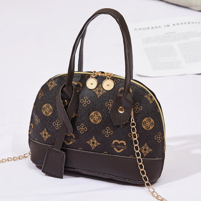2026 Nova Moda, Luxo Leve, Niche Monica & Friends Bolsa Feminina de Alto Padrão - Bolsa Shell com Bloco de Cores Estampado