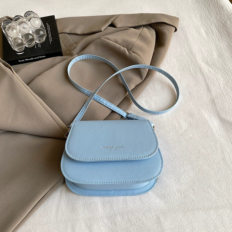 Bolsa de ombro versátil nova de outono e inverno em cores doces, bolsa de sela moderna, fresca e de alto padrão, bolsa transversal para mulheres