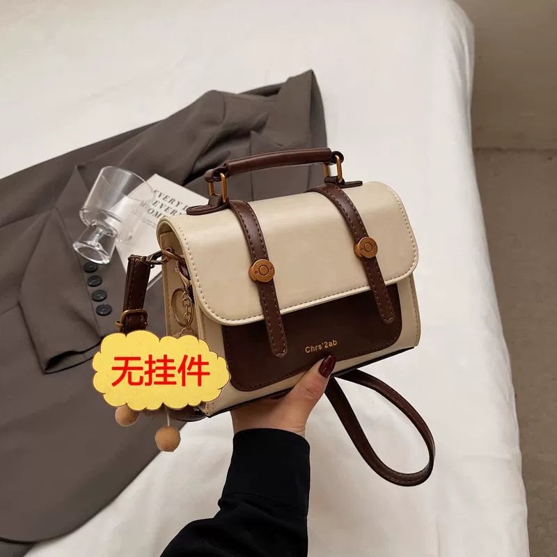 Bolsa pequena retrô de textura sofisticada, nova bolsa transversal versátil feminina, bolsa quadrada pequena de mão super moderna e popular.