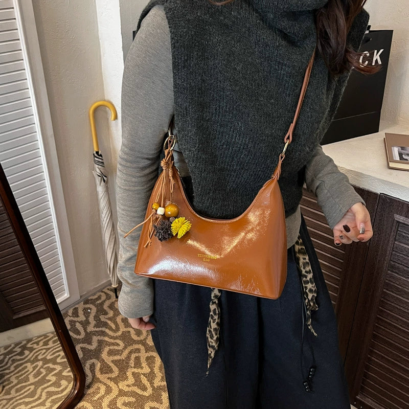 Bolsa de couro texturizado a óleo para atacado internacional, feminina, nova coleção 2026, moda, mais fácil de combinar, bolsa tiracolo, de ombro, pequena, para usar embaixo do braço.