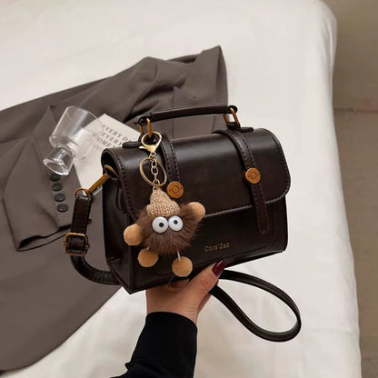 Bolsa pequena retrô de textura sofisticada, nova bolsa transversal versátil feminina, bolsa quadrada pequena de mão super moderna e popular.