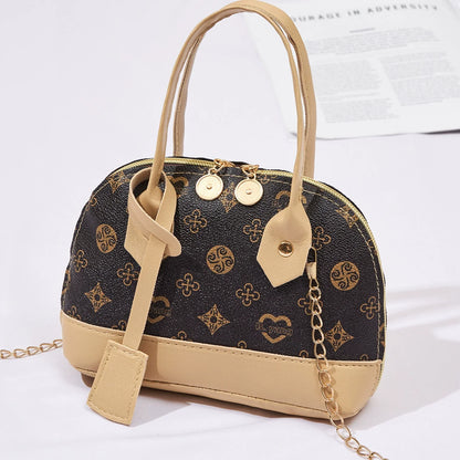 2026 Nova Moda, Luxo Leve, Niche Monica & Friends Bolsa Feminina de Alto Padrão - Bolsa Shell com Bloco de Cores Estampado
