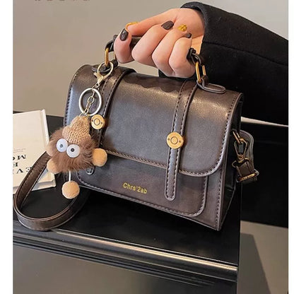 Bolsa pequena retrô de textura sofisticada, nova bolsa transversal versátil feminina, bolsa quadrada pequena de mão super moderna e popular.