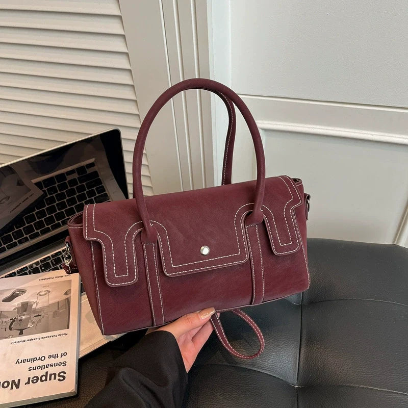 Bolsas de nicho de alto padrão para mulheres, nova coleção primavera/verão 2026, bolsa vintage versátil de ombro e transversal, bolsa feminina popular.