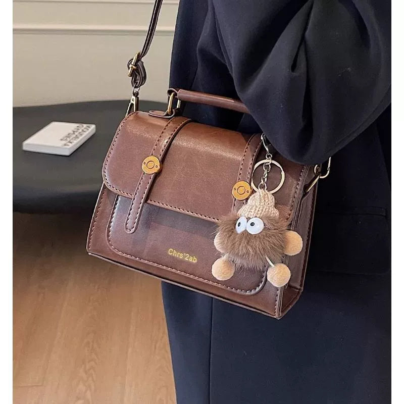 Bolsa pequena retrô de textura sofisticada, nova bolsa transversal versátil feminina, bolsa quadrada pequena de mão super moderna e popular.