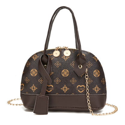 2026 Nova Moda, Luxo Leve, Niche Monica & Friends Bolsa Feminina de Alto Padrão - Bolsa Shell com Bloco de Cores Estampado