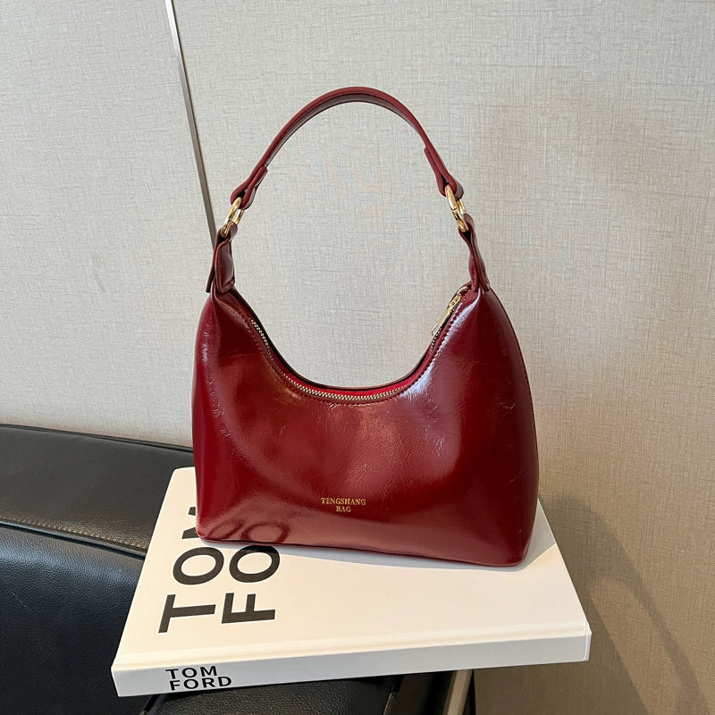Bolsa de couro texturizado a óleo para atacado internacional, feminina, nova coleção 2026, moda, mais fácil de combinar, bolsa tiracolo, de ombro, pequena, para usar embaixo do braço.