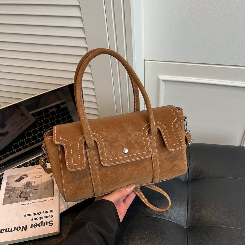 Bolsas de nicho de alto padrão para mulheres, nova coleção primavera/verão 2026, bolsa vintage versátil de ombro e transversal, bolsa feminina popular.