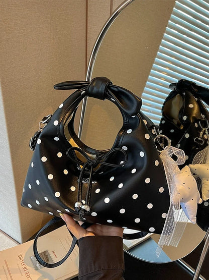 A bolsa feminina da moda deste ano com laço e bolinhas, uma novidade elegante e versátil de 2026. Uma bolsa transversal chique que também pode ser usada como bolsa de ombro ou carregada como bolsa de mão.