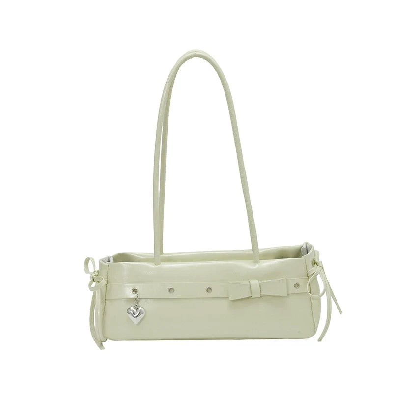 Bolsa baguete de alto estilo para mulheres, uma bolsa de ombro de couro fresca e versátil, uma bolsa moderna e versátil para mulheres jovens.