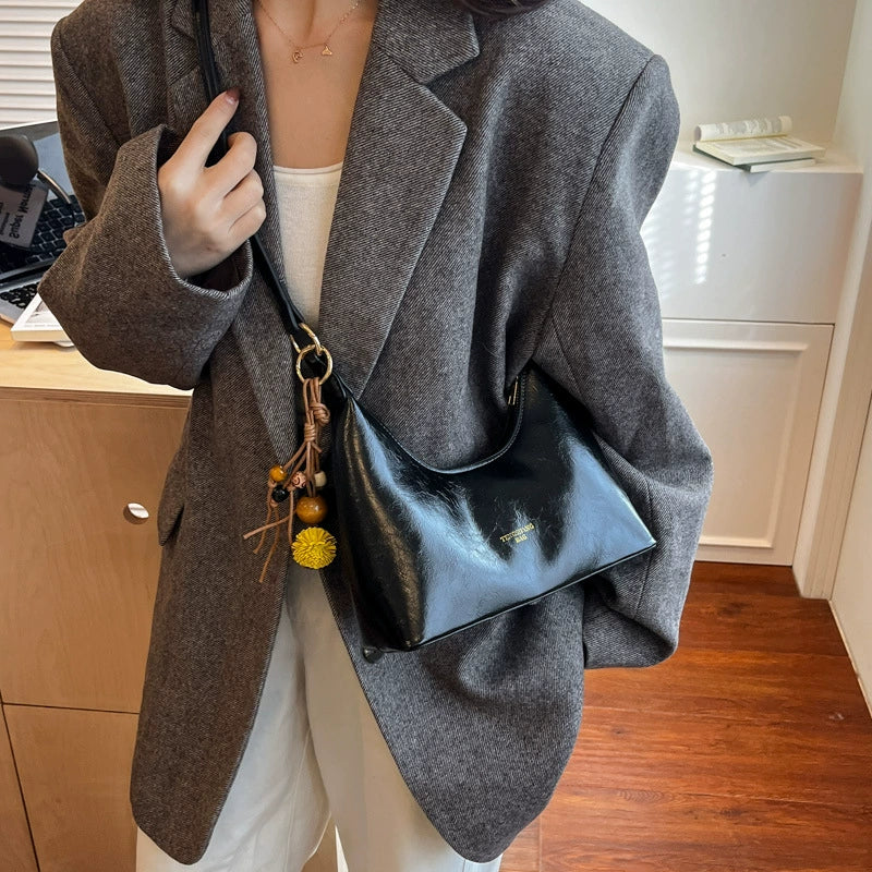 Bolsa de couro texturizado a óleo para atacado internacional, feminina, nova coleção 2026, moda, mais fácil de combinar, bolsa tiracolo, de ombro, pequena, para usar embaixo do braço.
