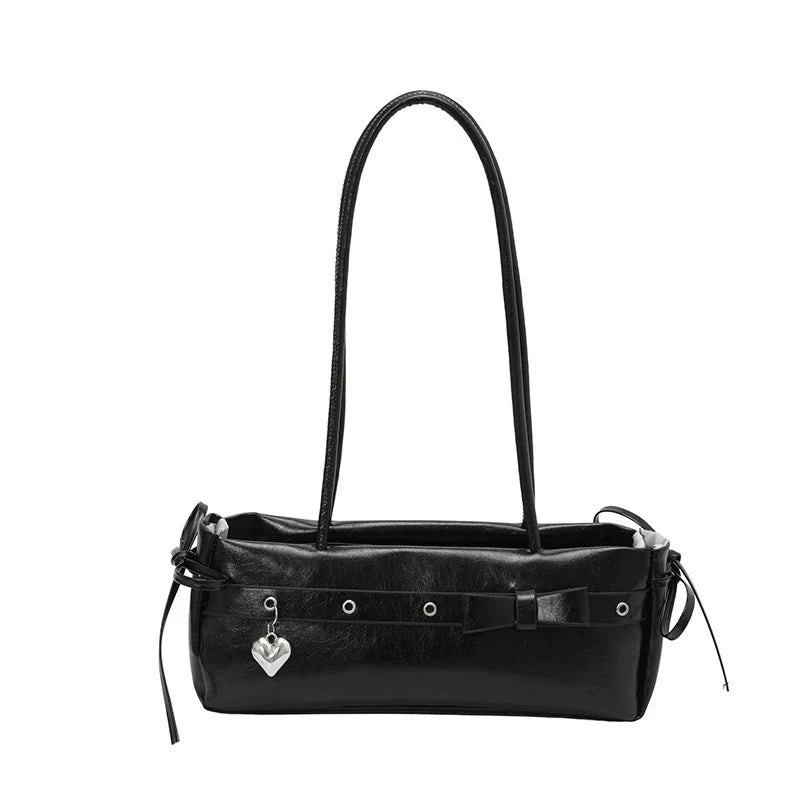 Bolsa baguete de alto estilo para mulheres, uma bolsa de ombro de couro fresca e versátil, uma bolsa moderna e versátil para mulheres jovens.